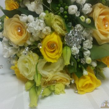 Hand tied bridal wedding bouquet of Moonwalk yellow roses - Wedding flowers by Rhiann. Stoke on Trent, Staffordshire